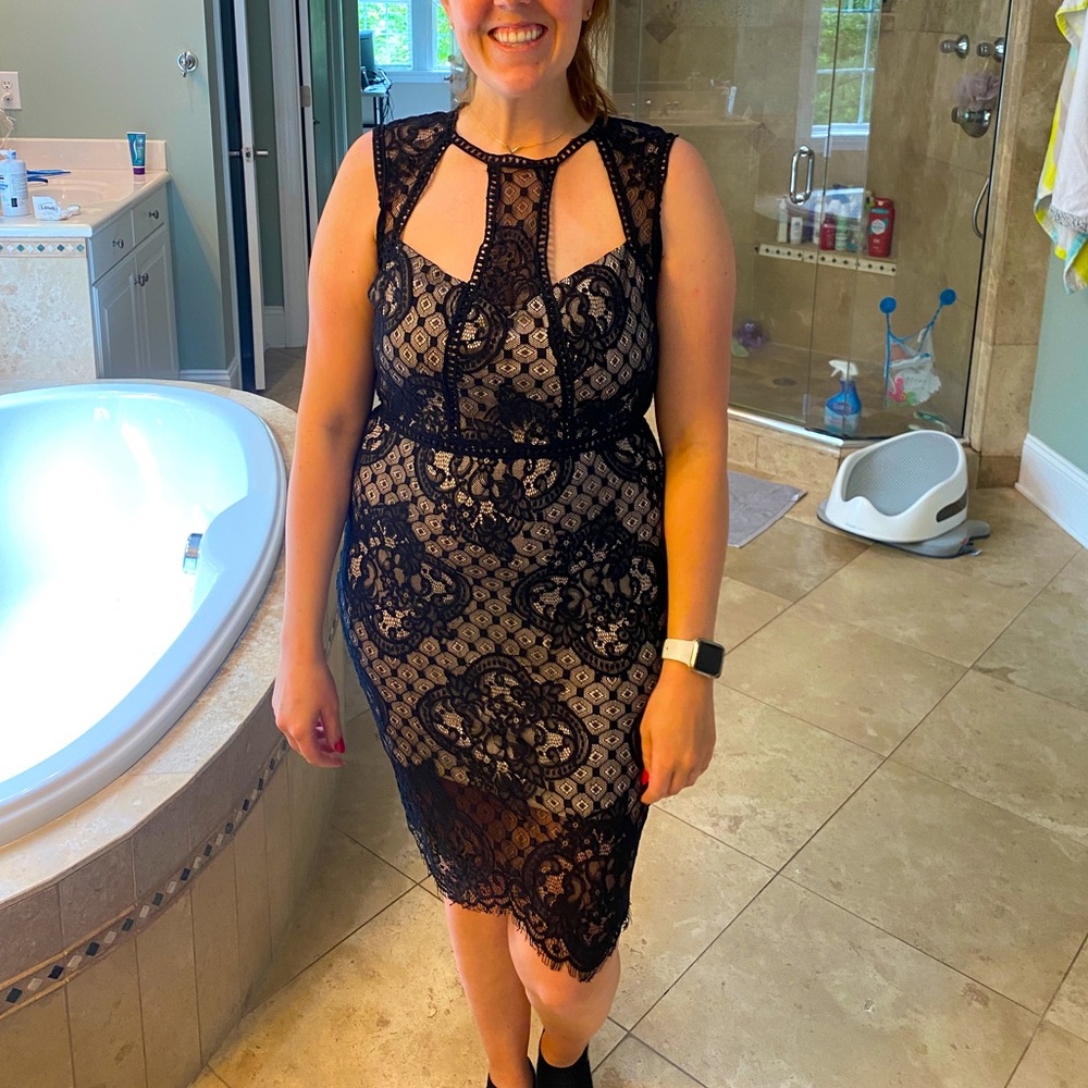Main Strip Black and tan lace boutique cutout dress.
